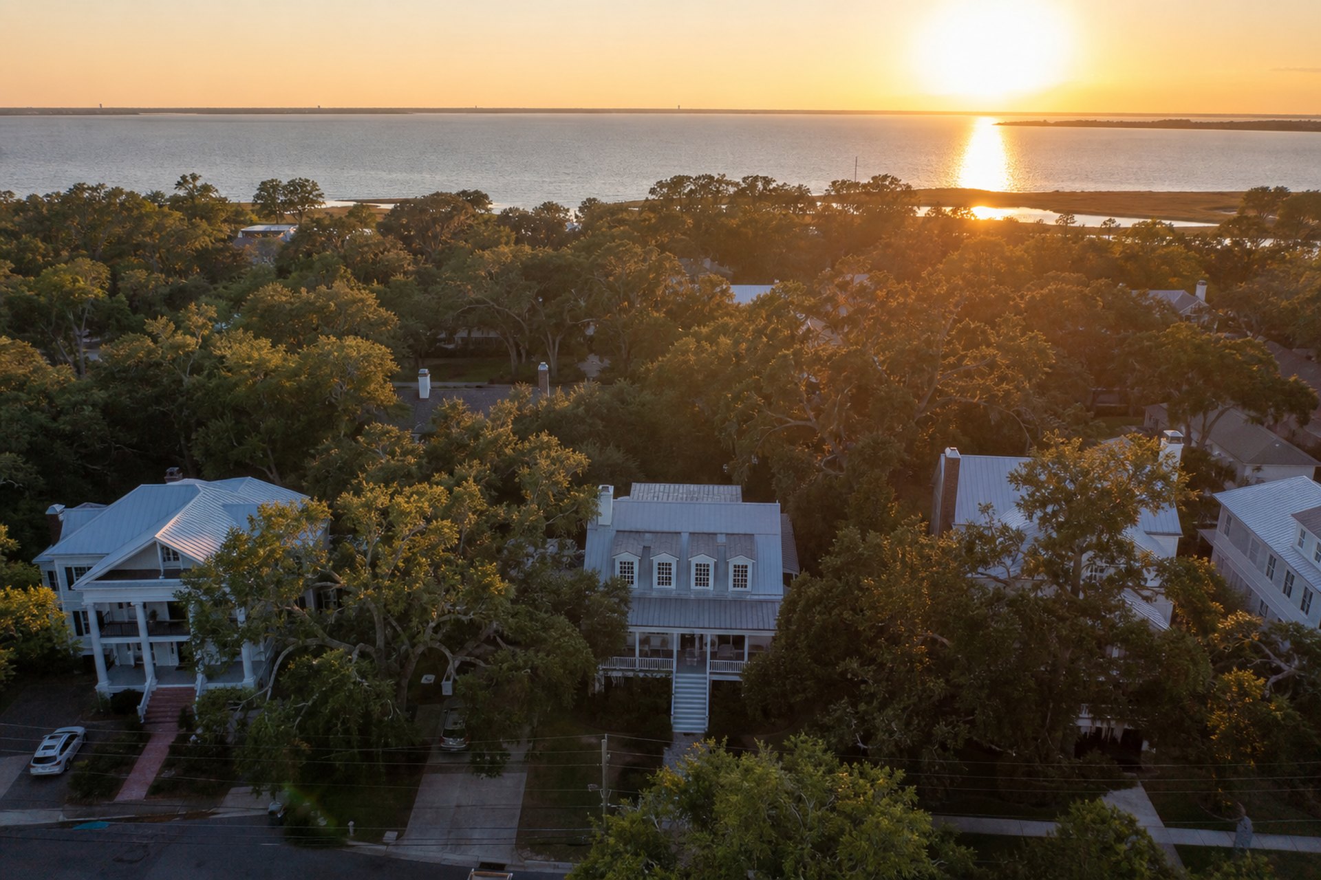 Live oak lined street above Mobile Bay on the Alabama Eastern Shore at sunset